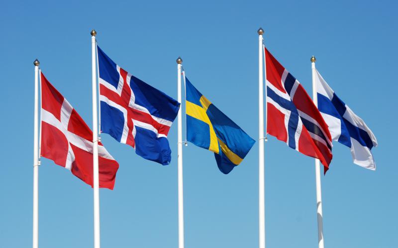 Scandinavian flags on a blue sky.